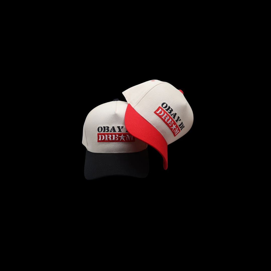 Mock up showing Obay Di Dream trucker hats black and red with snapack closure and embroidery front logo