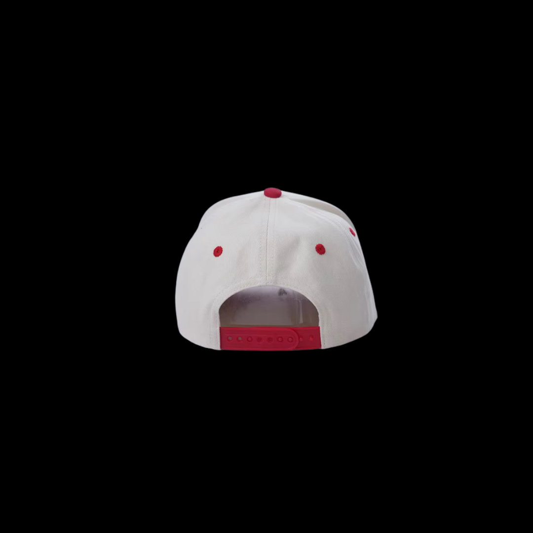 Back view showing adjustable snapback closure on red OBAY DI DREAM trucker cap.