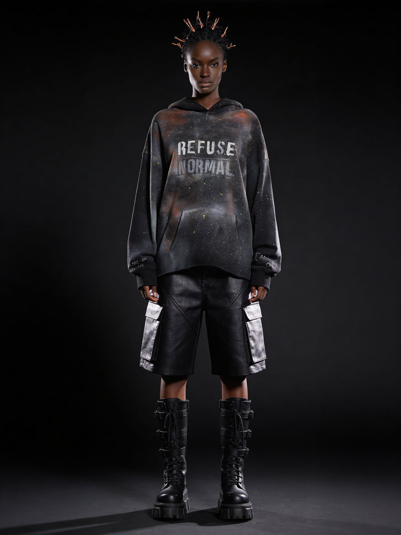 Sovereign figure wearing hand-painted black galaxy fleece, REFUSE NORMAL stencil front, cropped raw hem, styled with waxed shorts and platform boots — OBAY DI DREAM Artifact_07